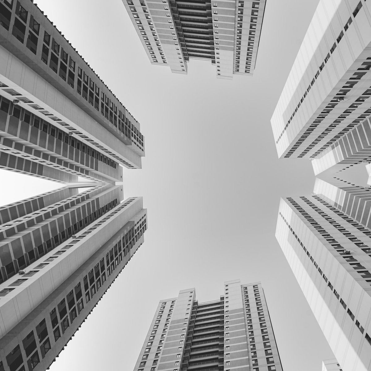 grayscale photo of high rise buildings